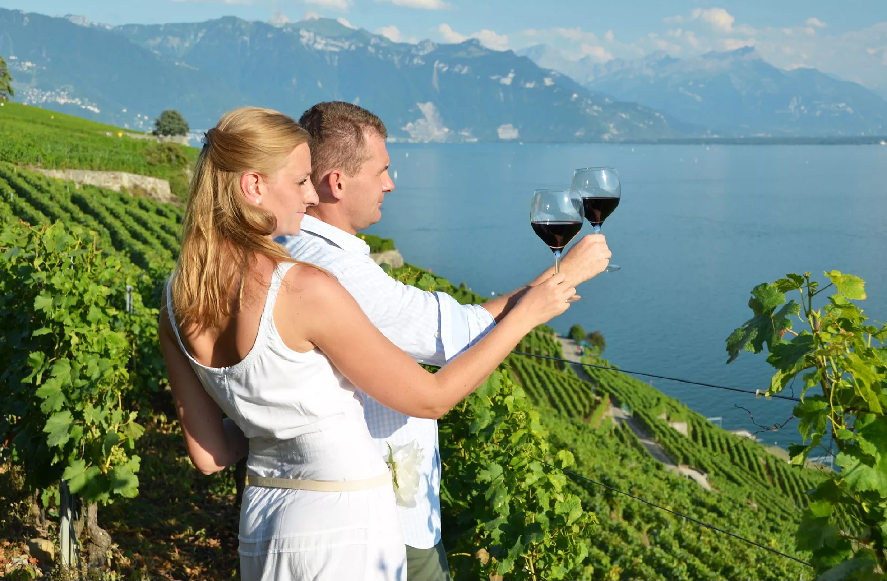A-couple-enjoying-wine-in-Lavaux-Vineyards