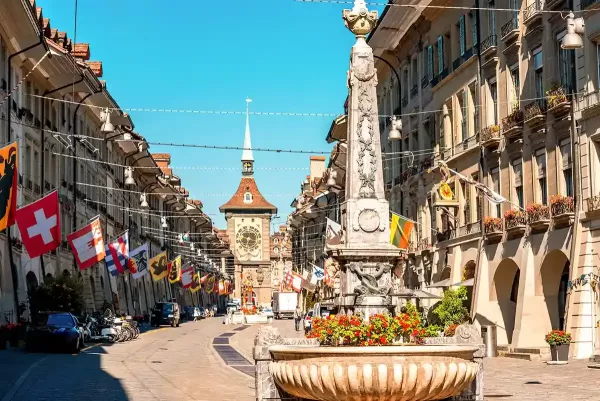 Street view on Kramgasse with fountain and Clock Tower in the Old Town
